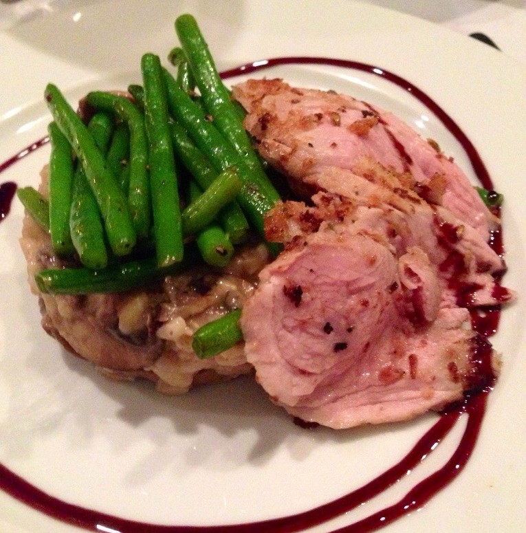 Toasted fennel seed and parm crusted pork tenderloin over wild mushroom risotto and haricot Verts.