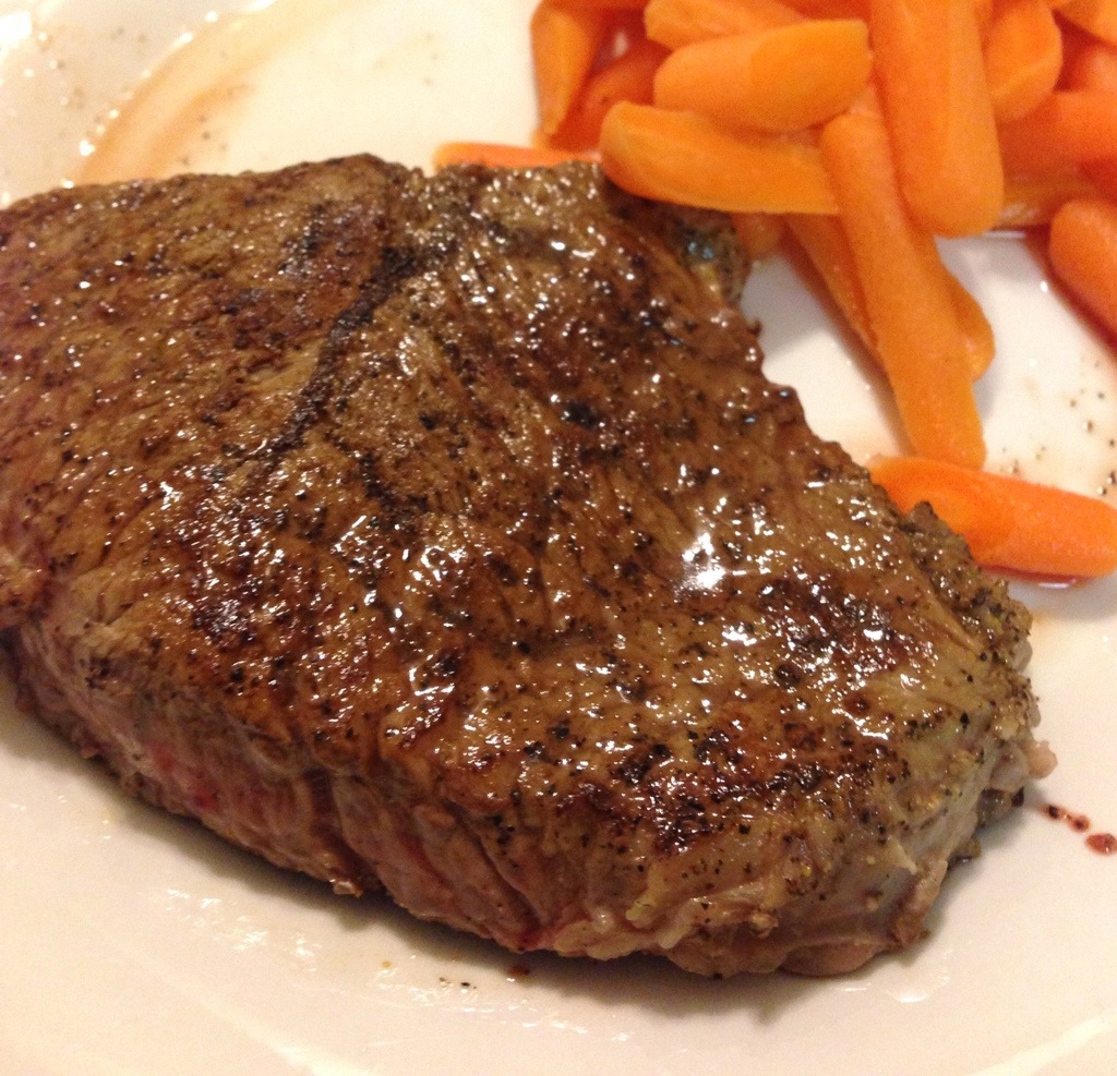 Medium rare steak with carrots